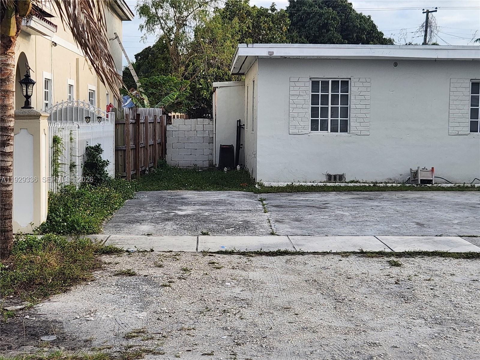 342 East 46th Street, Unit 1 Hialeah, FL 33013 - Photo 22 of 26 a front view of a house with a yard