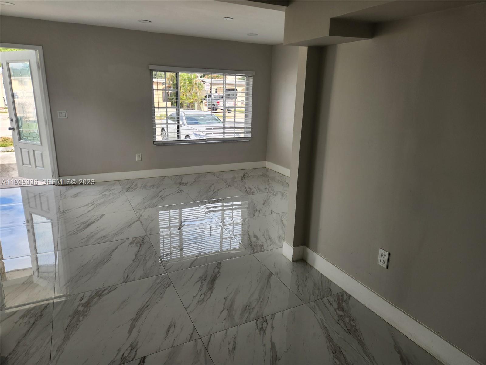342 East 46th Street, Unit 1 Hialeah, FL 33013 - Photo 6 of 26 an empty room with windows