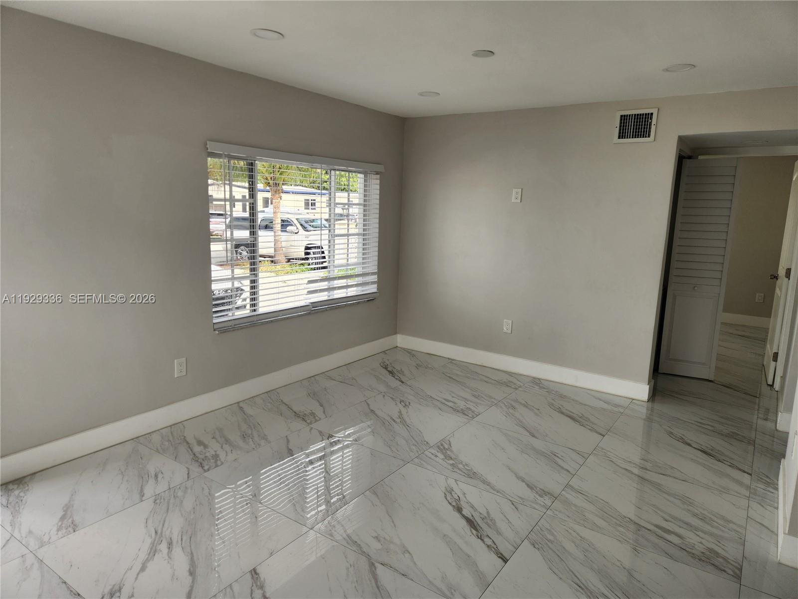 342 East 46th Street, Unit 1 Hialeah, FL 33013 - Photo 7 of 26 a view of an empty room with a window