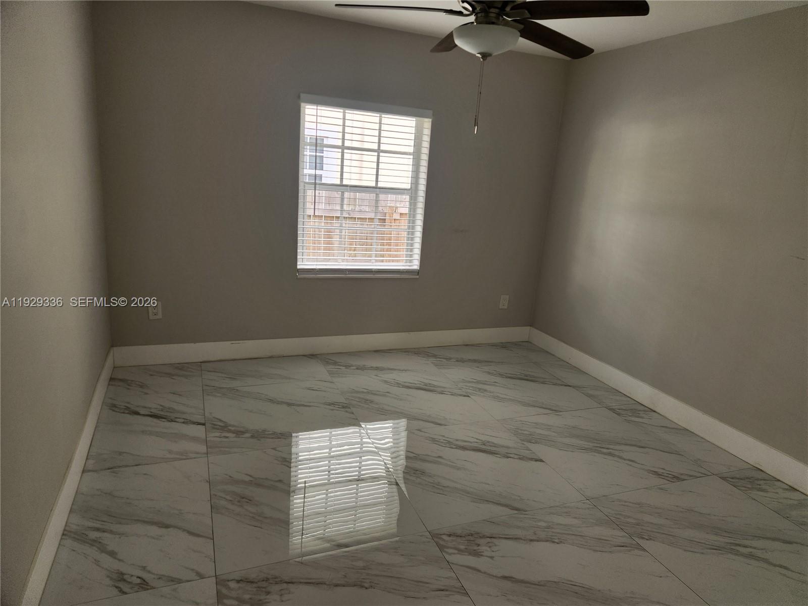 342 East 46th Street, Unit 1 Hialeah, FL 33013 - Photo 9 of 26 an empty room with a window
