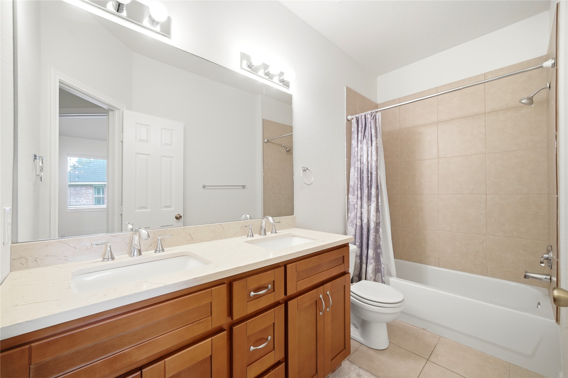 5411 Gate Canyon Court Spring, TX 77373 - Photo 31 of 33 a bathroom with a sink a toilet a mirror and shower