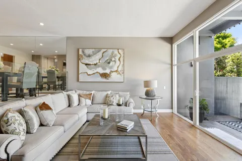 a living room with furniture and a rug