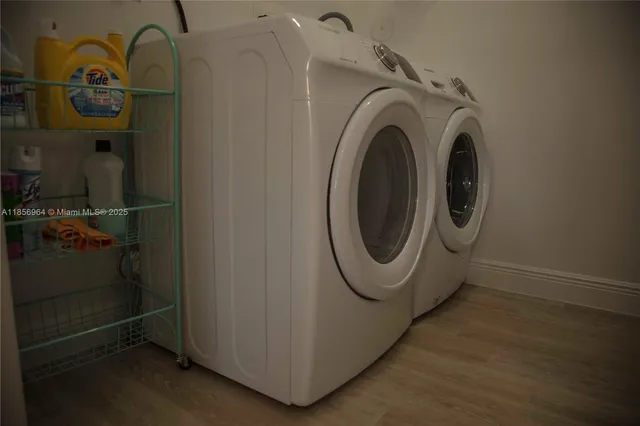 a utility room with dryer and washer
