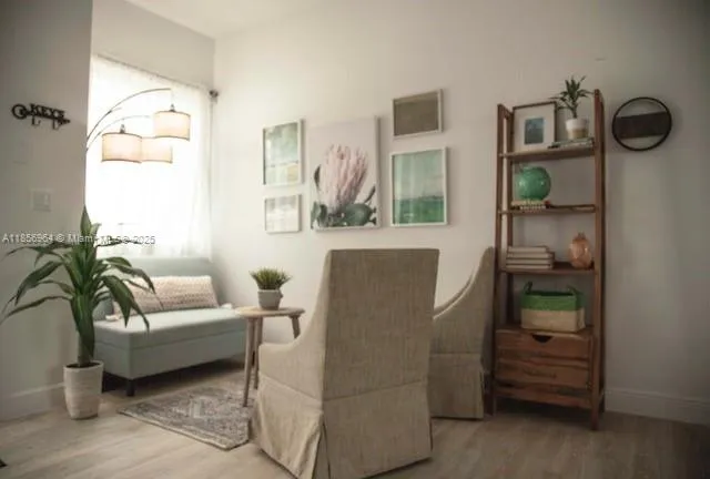 a living room with furniture and a window
