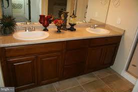 708 Tolbert Drive Odenton, MD 21113 - Photo 11 of 21 a bathroom with a sink and a mirror