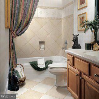 708 Tolbert Drive Odenton, MD 21113 - Photo 13 of 21 a bathroom with a toilet and a sink