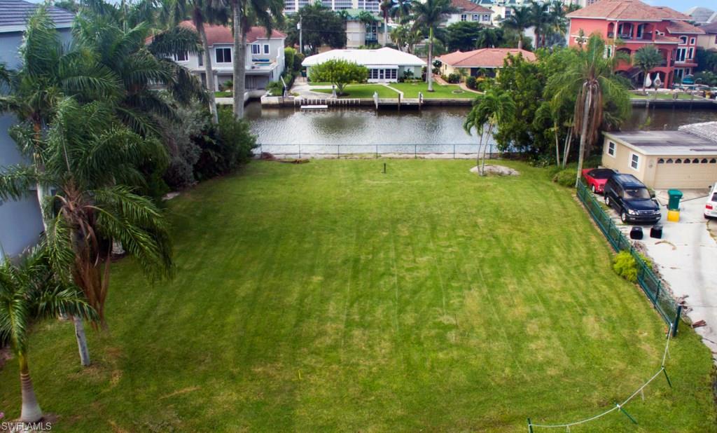 388 Pine Avenue Naples, FL 34108 - Photo 4 of 10 a view of swimming pool from a garden