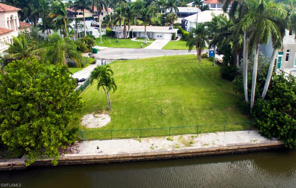 388 Pine Avenue Naples, FL 34108 - Photo 6 of 10 a view of swimming pool with a yard