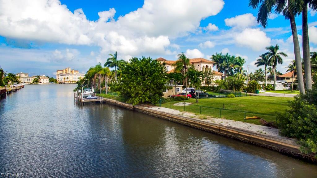 388 Pine Avenue Naples, FL 34108 - Photo 7 of 10 a view of a lake with a big yard