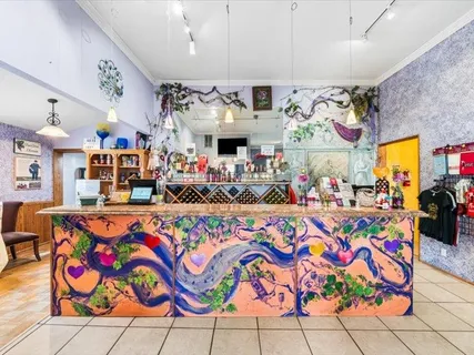 a view of a backyard with sitting area