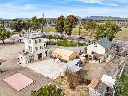 an aerial view of a house with a ocean view