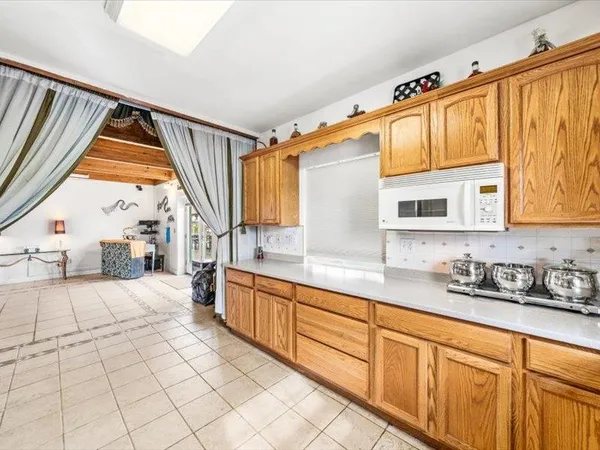 a kitchen with stainless steel appliances a sink and a refrigerator