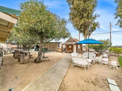 a view of a terrace with furniture and stove