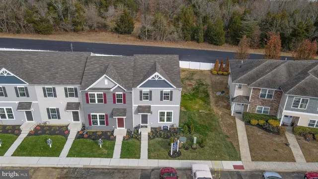 a view of multiple houses with a yard