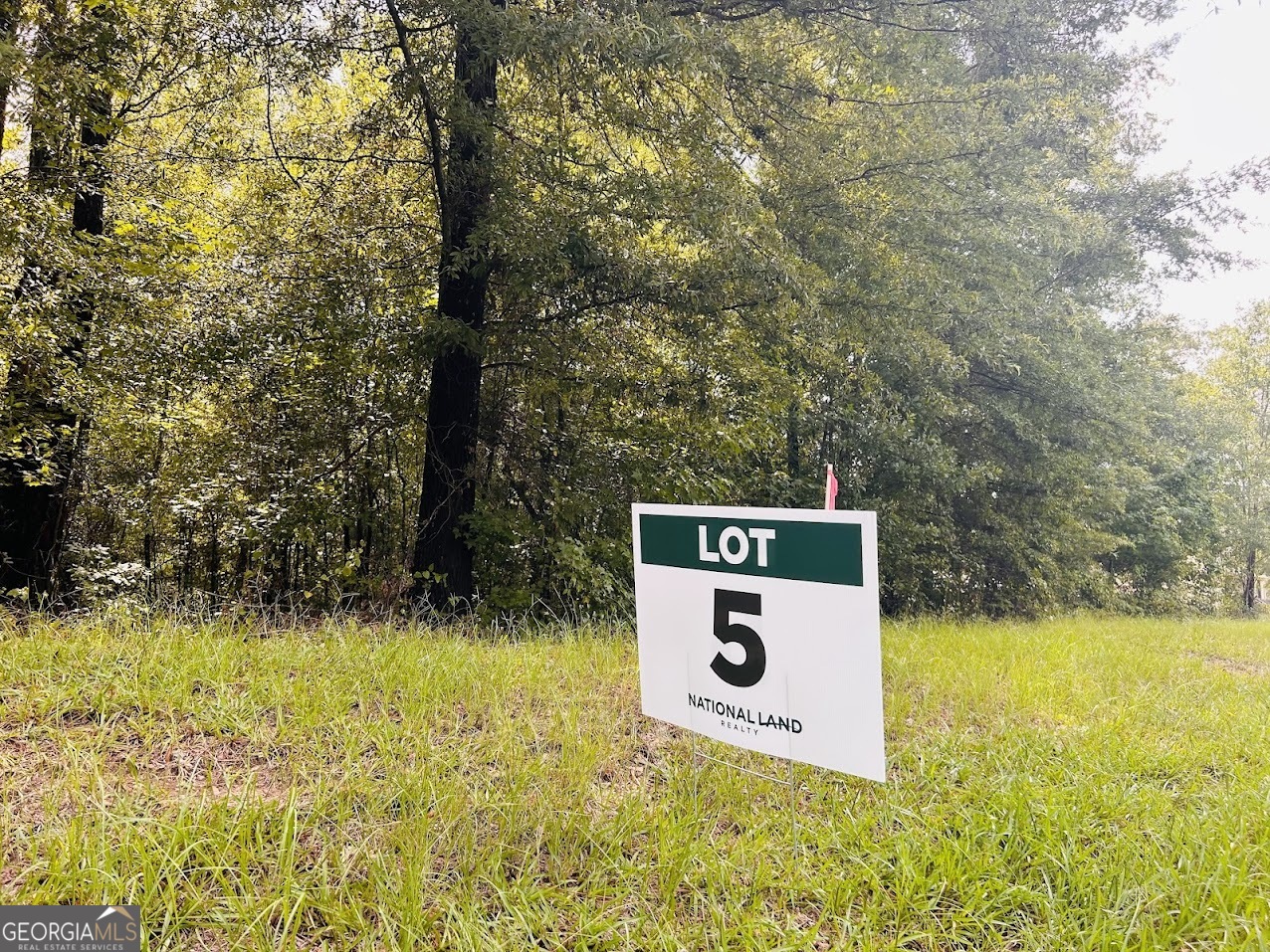 0 Kings Mill Road, Unit 5 Wrens, GA 30833 - Photo 2 of 24 a sign that is sitting in front of a tree