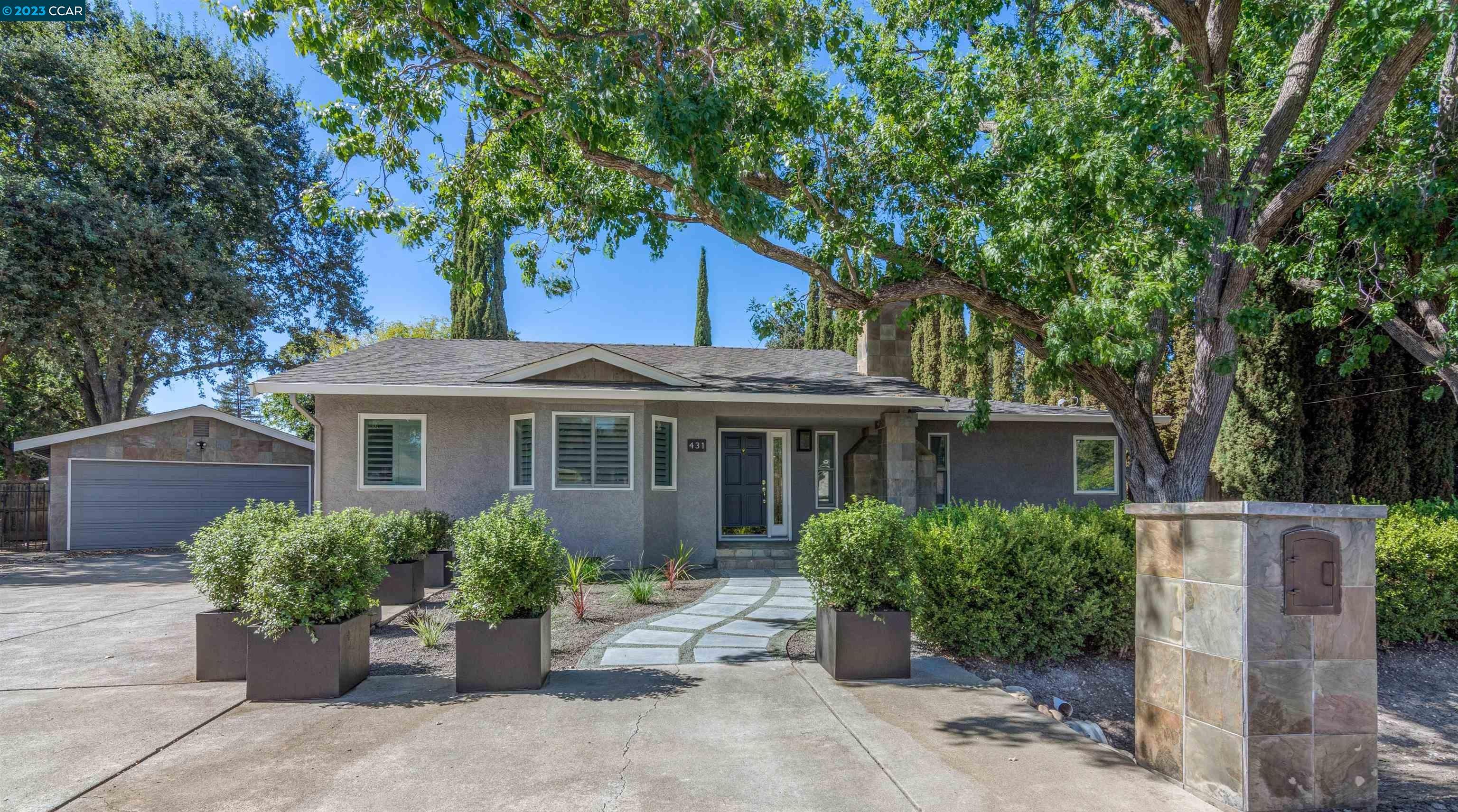 431 Bridge Road Walnut Creek, CA 94595 - Photo 1 of 1 a front view of a house with a garden