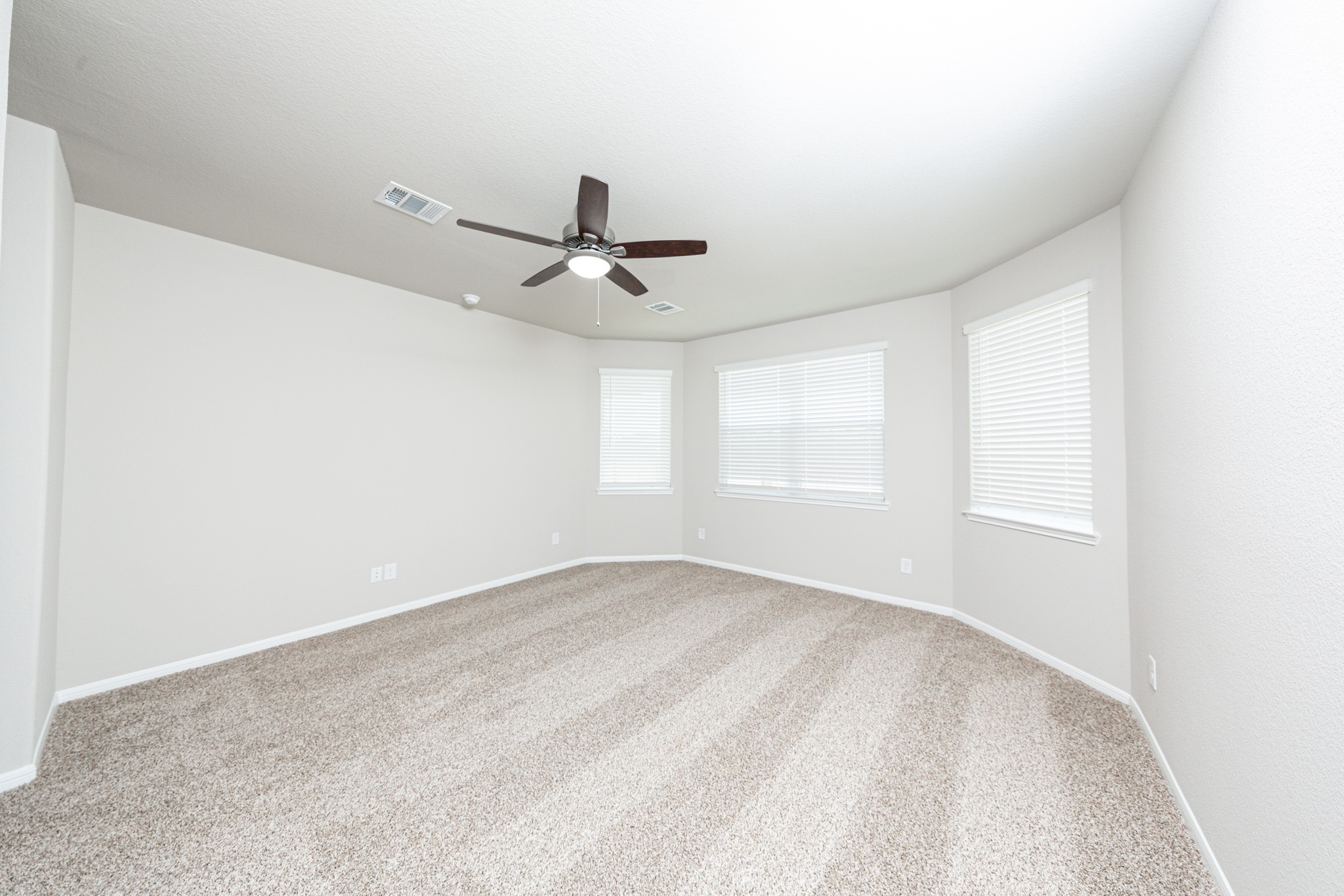 3042 Nickell Back Drive Conroe, TX 77301 - Photo 11 of 24 a view of a big room with wooden floor and windows