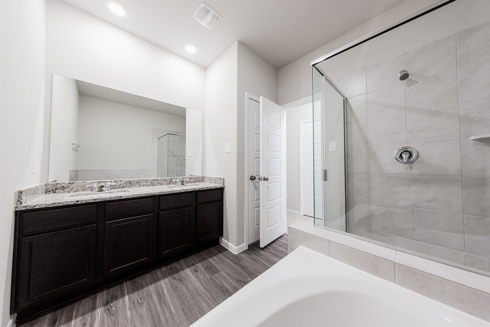 3042 Nickell Back Drive Conroe, TX 77301 - Photo 12 of 24 a spacious bathroom with a shower sink and mirror