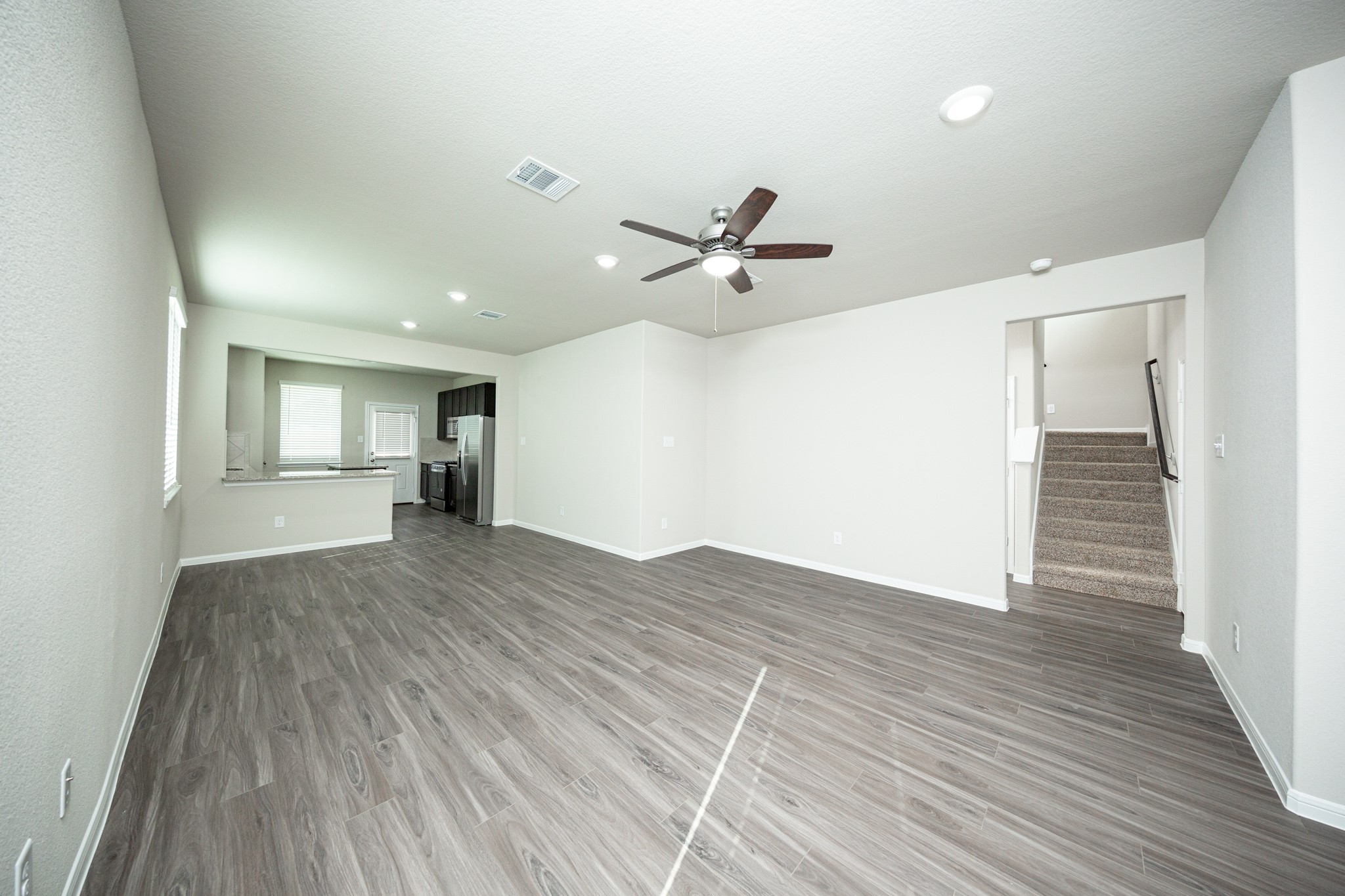3042 Nickell Back Drive Conroe, TX 77301 - Photo 5 of 24 a view of an empty room and wooden floor
