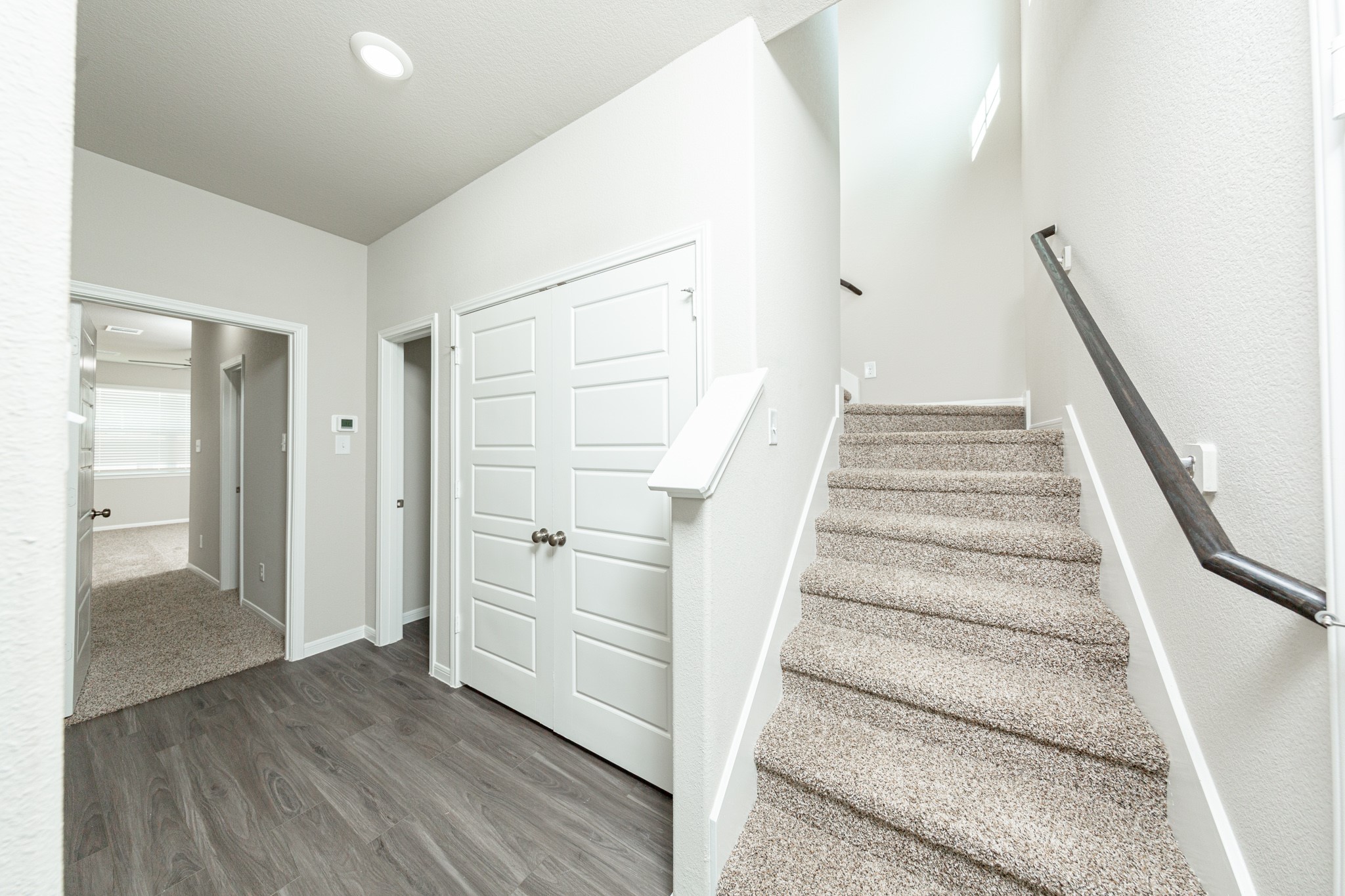 3042 Nickell Back Drive Conroe, TX 77301 - Photo 8 of 24 a view of entryway with wooden floor and stairs