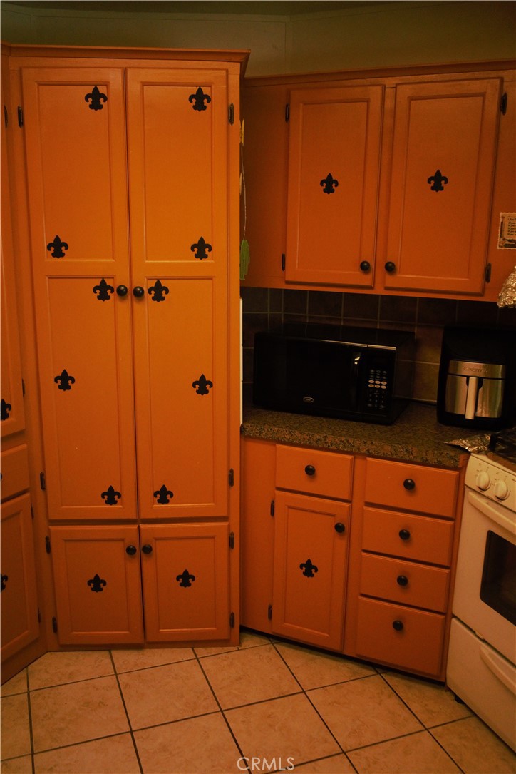 58870 Granite Gulley Road Anza, CA 92539 - Photo 14 of 29 a view of a closet with wooden cabinets