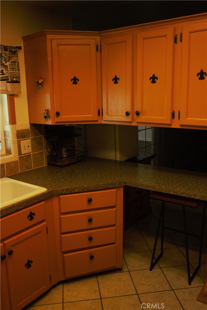 58870 Granite Gulley Road Anza, CA 92539 - Photo 15 of 29 a room with cabinets and wooden floor