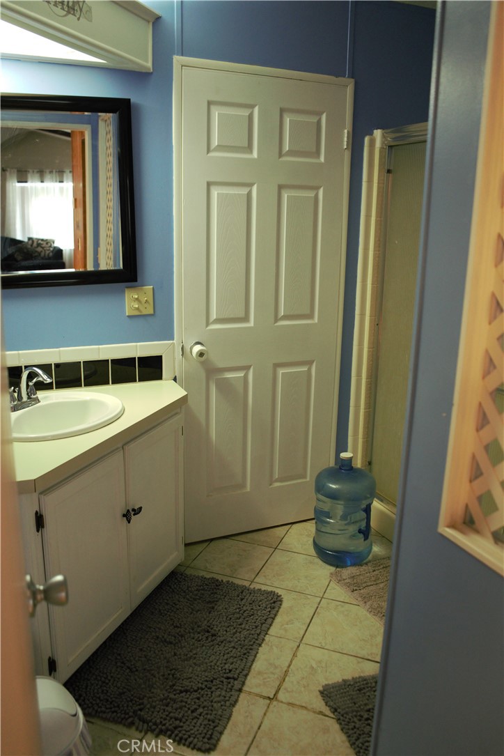 58870 Granite Gulley Road Anza, CA 92539 - Photo 18 of 29 a bathroom with a sink and a mirror