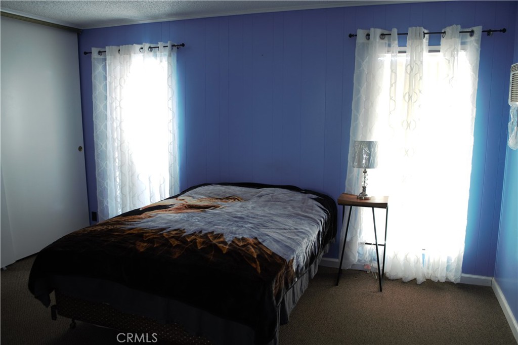 58870 Granite Gulley Road Anza, CA 92539 - Photo 21 of 29 a bedroom with a bed and a window