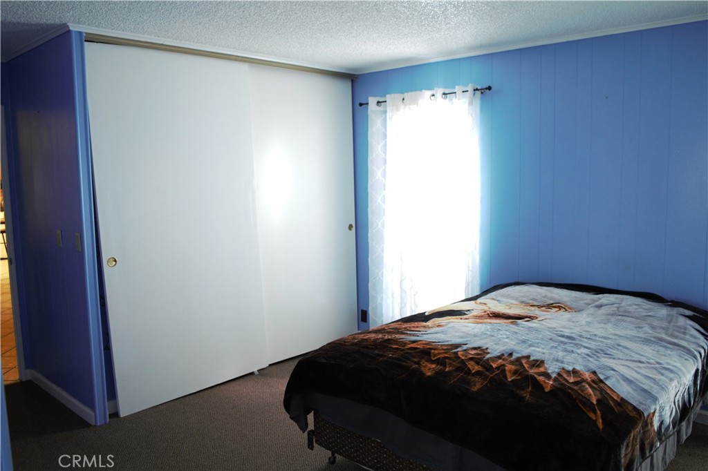 58870 Granite Gulley Road Anza, CA 92539 - Photo 22 of 29 a bedroom with a bed and a window