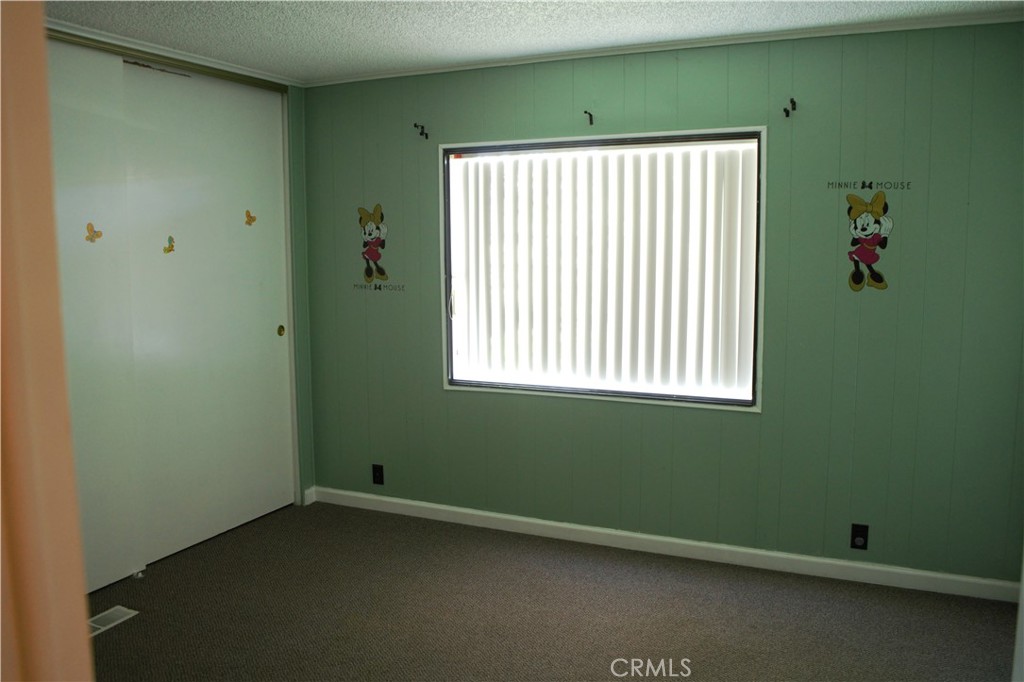 58870 Granite Gulley Road Anza, CA 92539 - Photo 28 of 29 a view of an empty room with a window and a ceiling fan