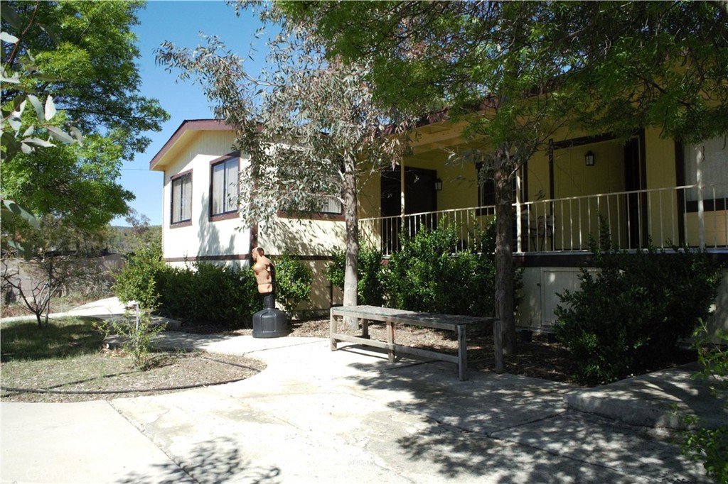 58870 Granite Gulley Road Anza, CA 92539 - Photo 7 of 29 a chair and table in front of house
