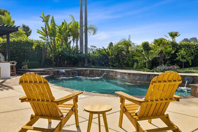 a view of a terrace with a table and chairs