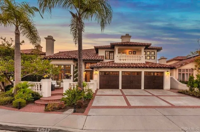 a view of a swimming pool with a lounge chair and tables