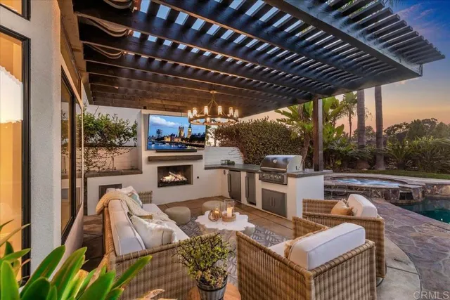 a living room with furniture large window and wooden floor