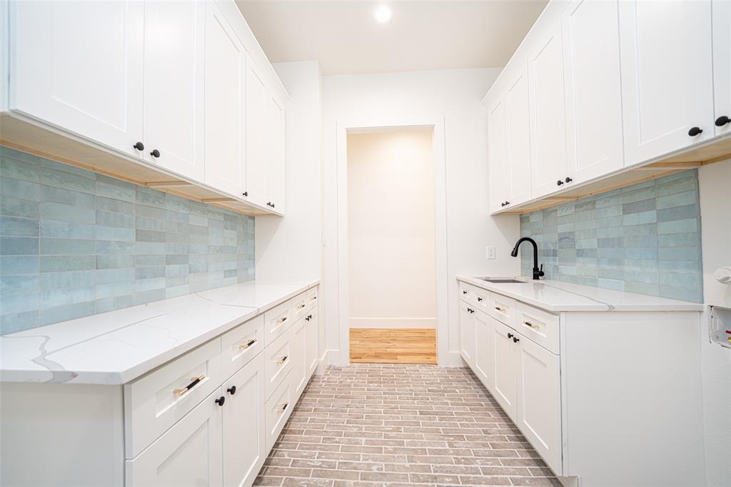 643 North Private Road Leesburg, TX 75451 - Photo 19 of 40 a room with white cabinets and sink