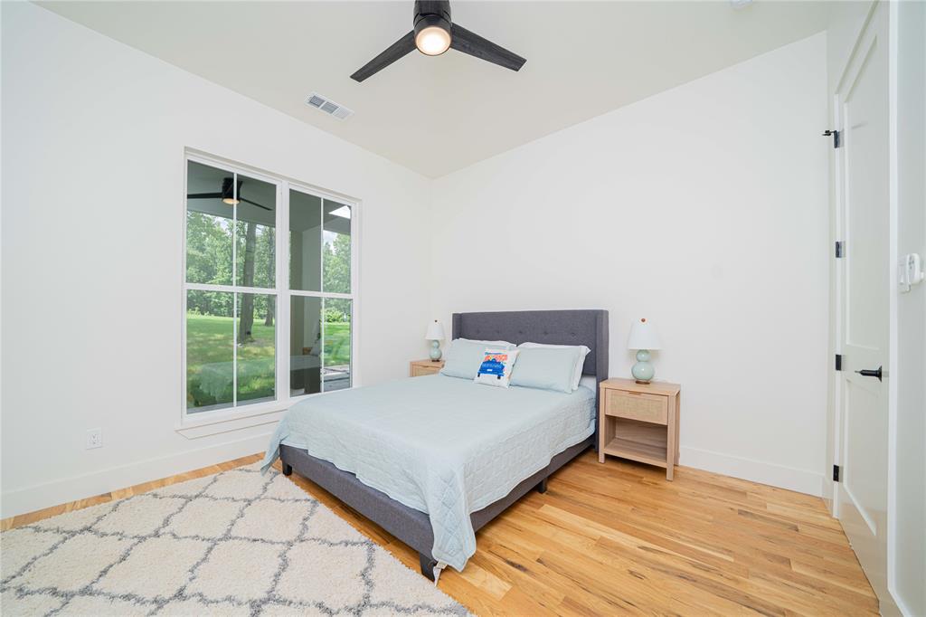 643 North Private Road Leesburg, TX 75451 - Photo 23 of 40 a bedroom with a bed and window