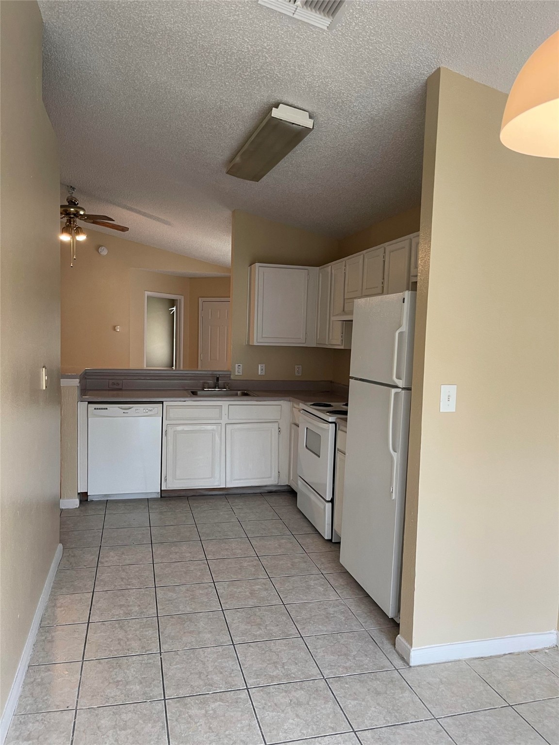 4647 Croker Ridge Road Houston, TX 77053 - Photo 3 of 6 a kitchen with cabinets and white appliances