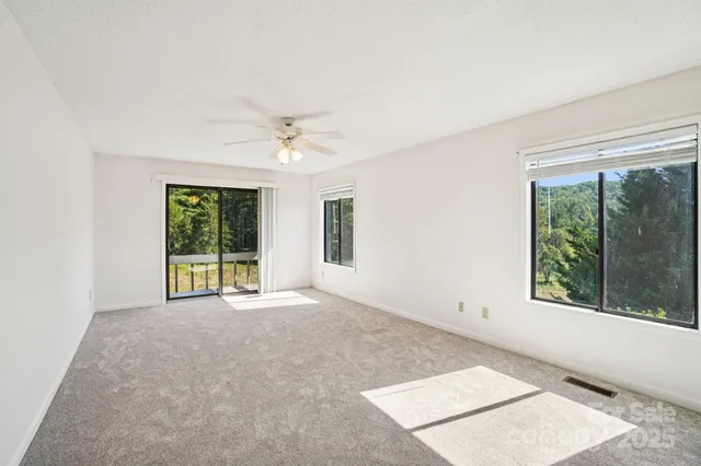 a bathroom with a glass shower door