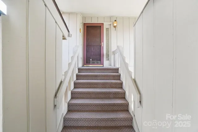 a view of a livingroom with a hall and an entryway