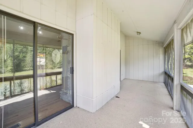 a view of a backyard with large trees