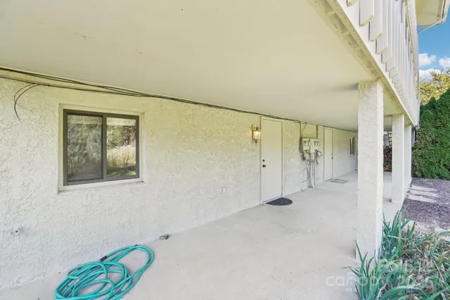 a view of porch and floor to ceiling window