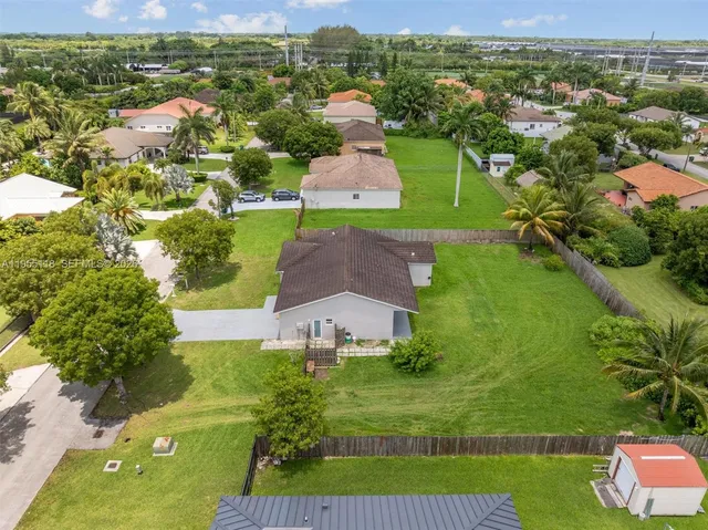 an aerial view of a house with a garden