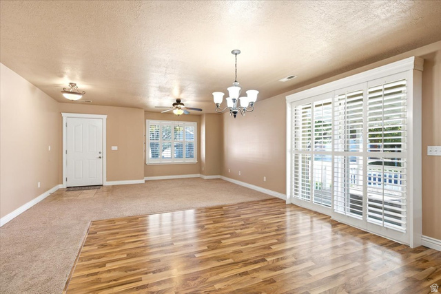 1089 West 2325th Street North Layton, UT 84041 - Photo 7 of 40 Interior space featuring wood-finish flooring, carpeted area, and neutral wall tones