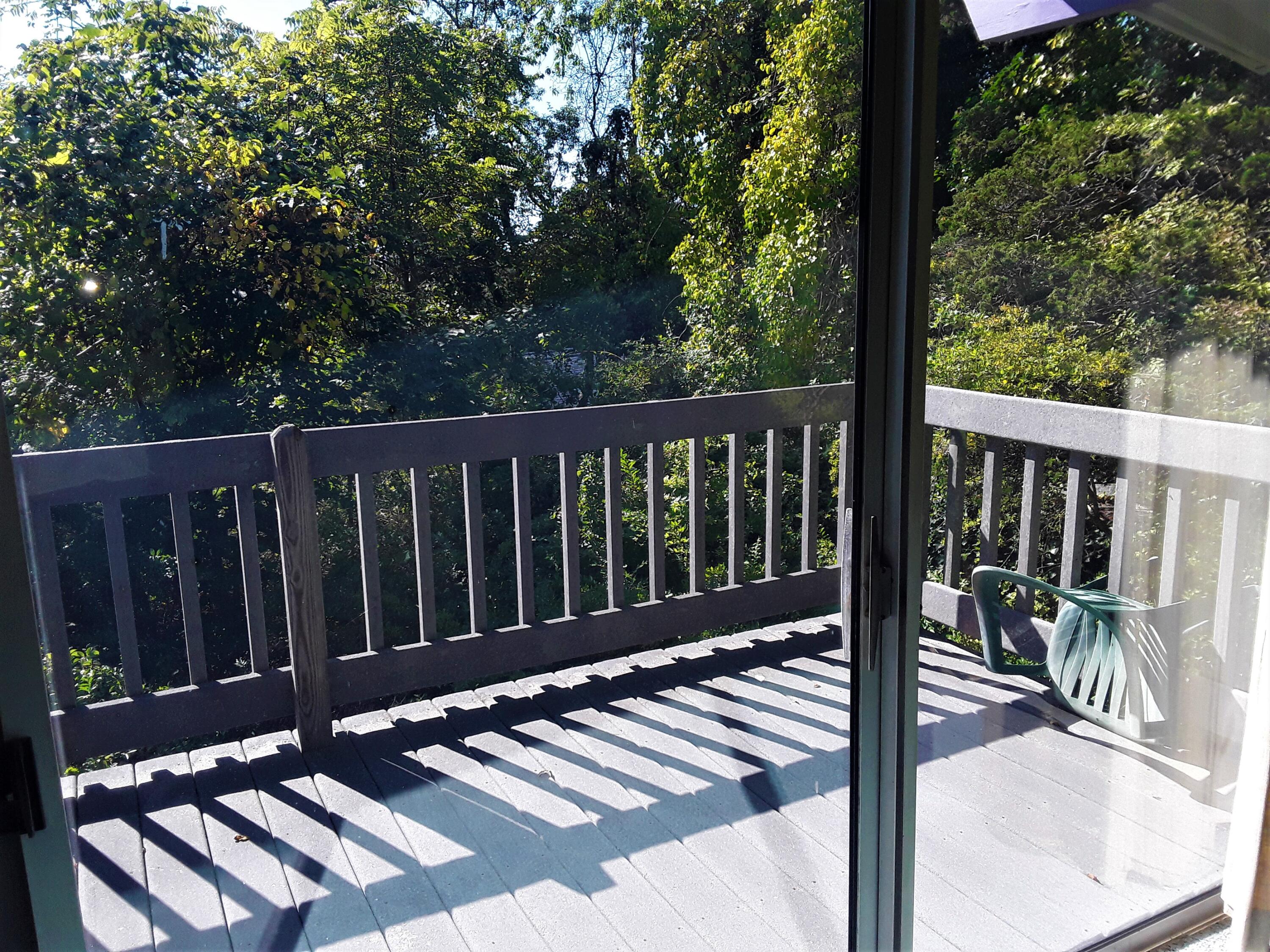60 Cedar Land Road Orleans, MA 02653 - Photo 15 of 30 a view of balcony with wooden floor and fence