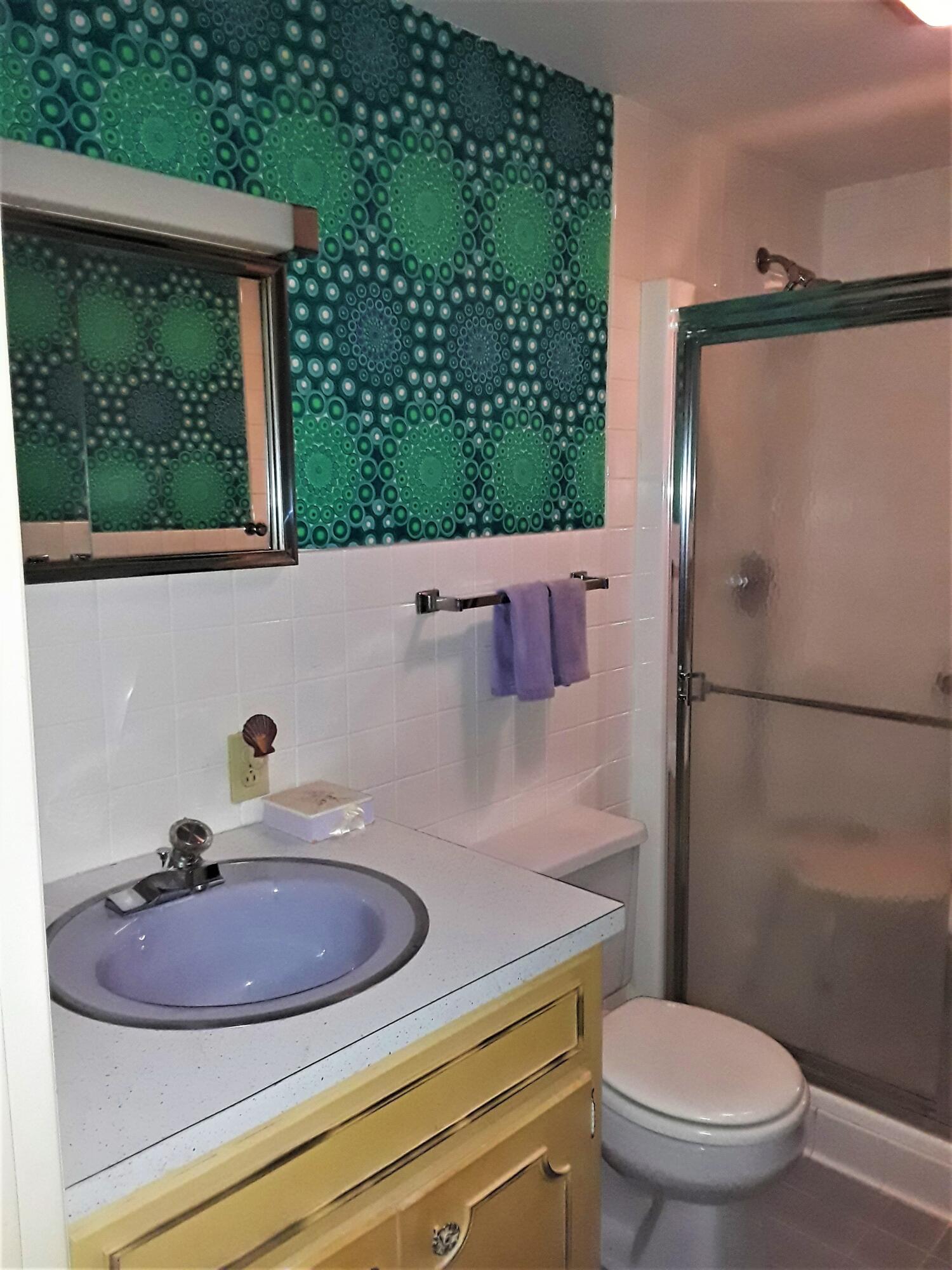60 Cedar Land Road Orleans, MA 02653 - Photo 19 of 30 a bathroom with a sink a toilet and a mirror