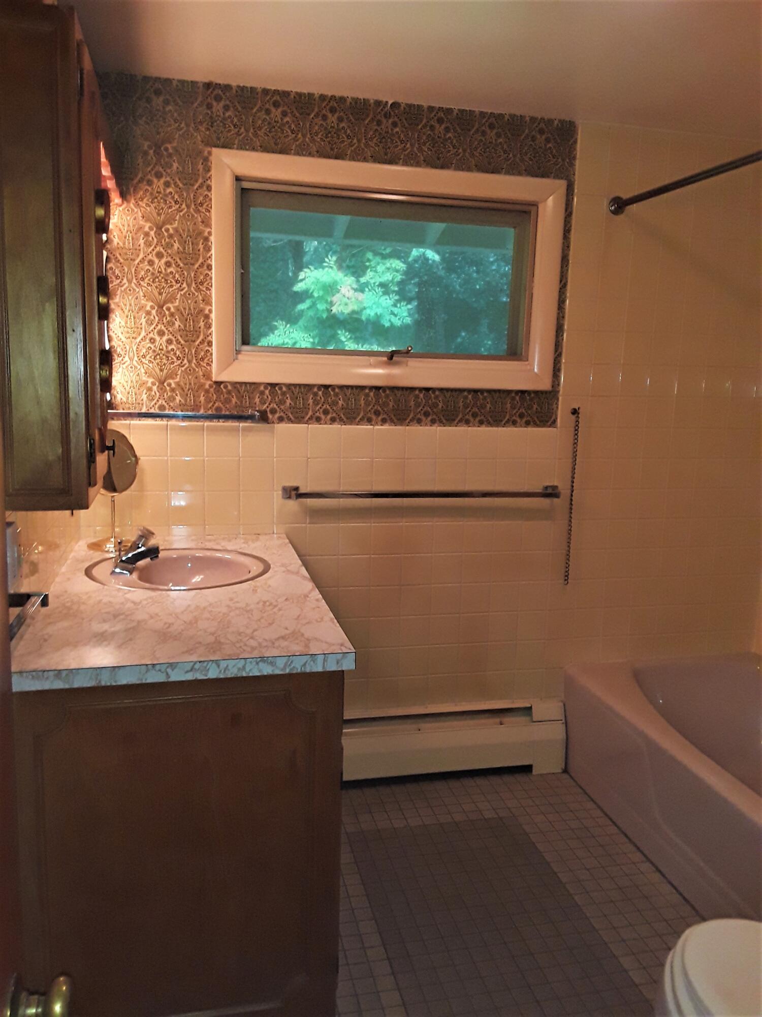 60 Cedar Land Road Orleans, MA 02653 - Photo 21 of 30 a bathroom with a granite countertop sink and a toilet