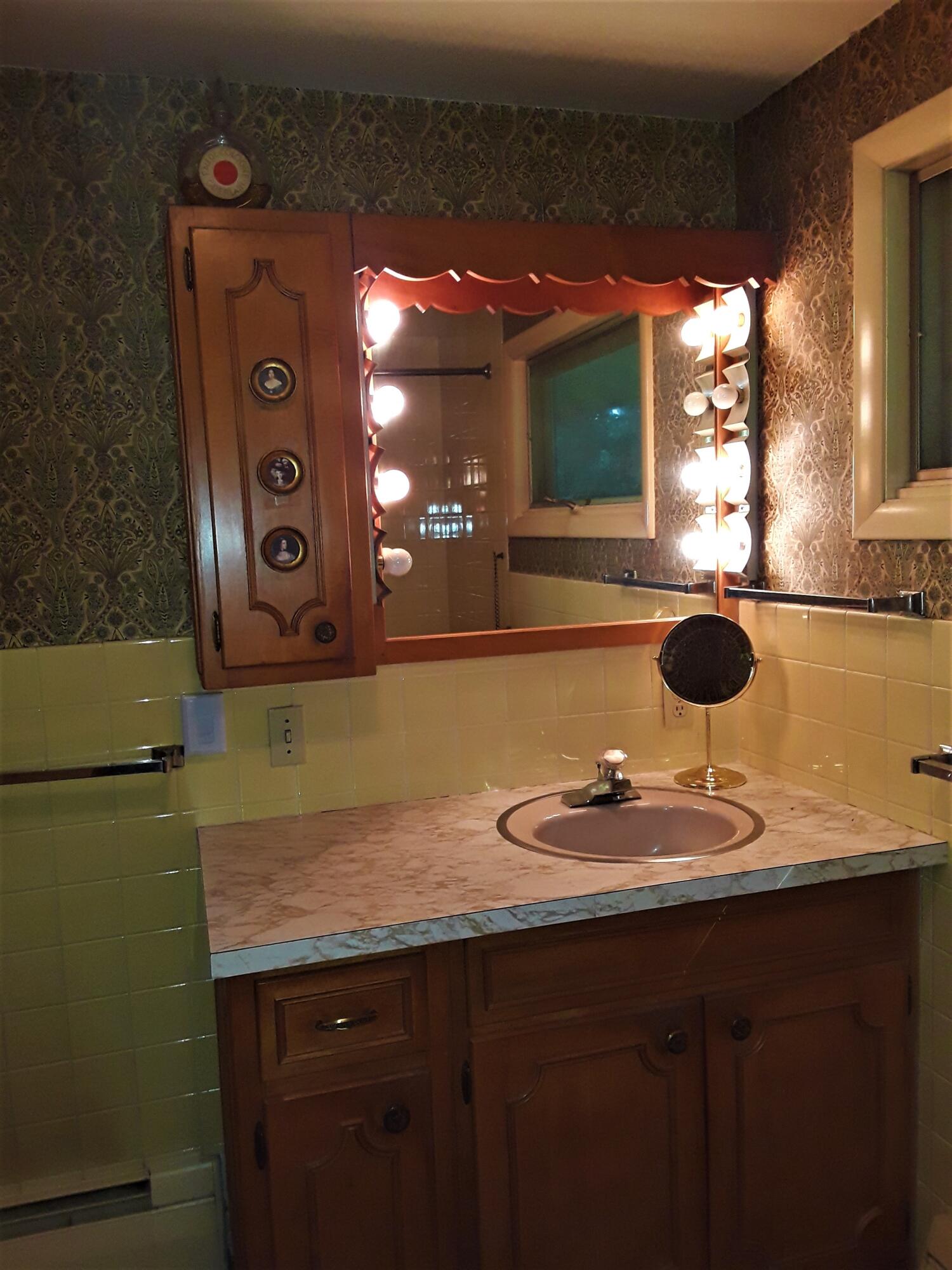 60 Cedar Land Road Orleans, MA 02653 - Photo 22 of 30 a bathroom with a sink and a mirror