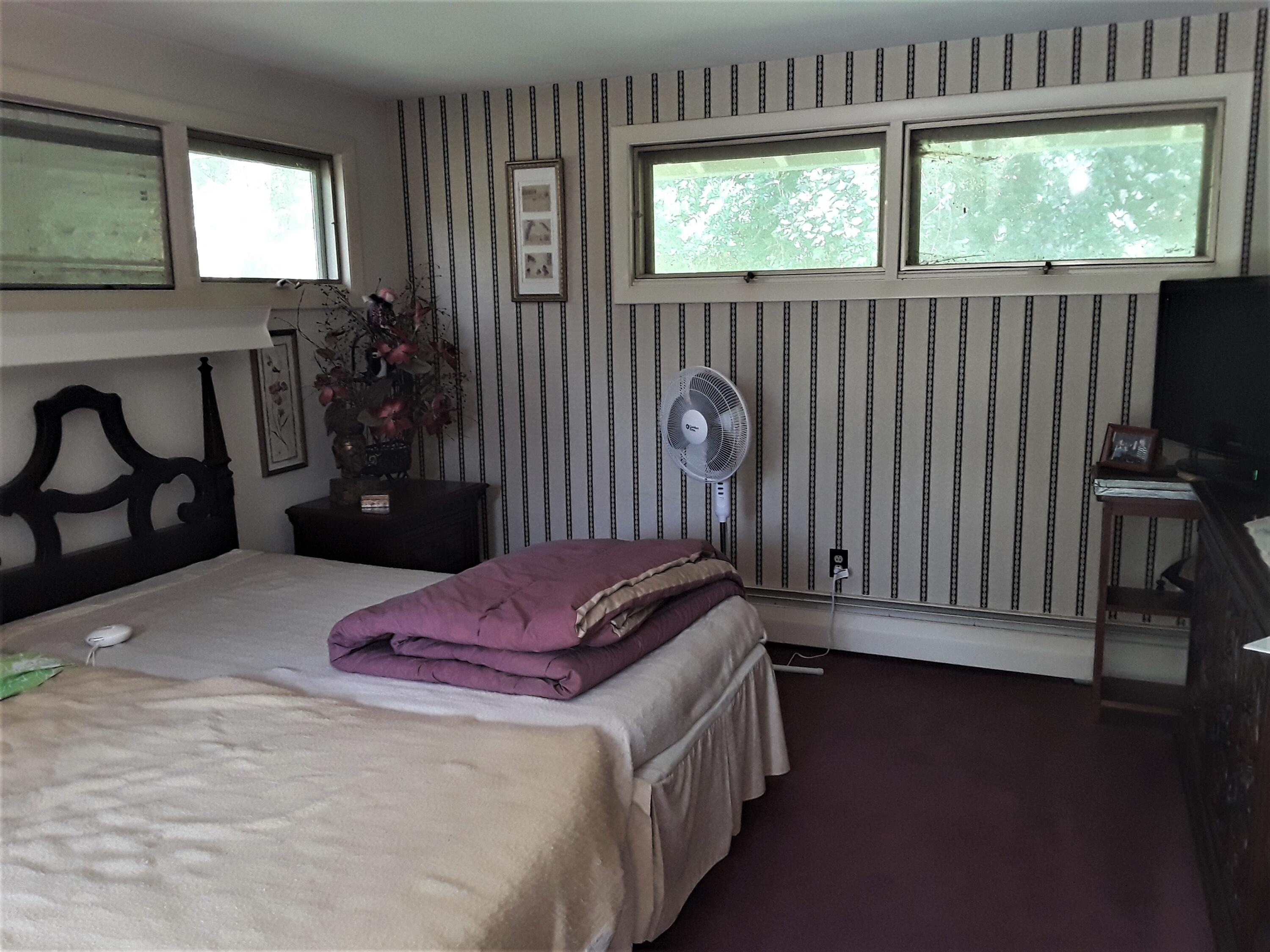 60 Cedar Land Road Orleans, MA 02653 - Photo 23 of 30 a bedroom with a bed and a window