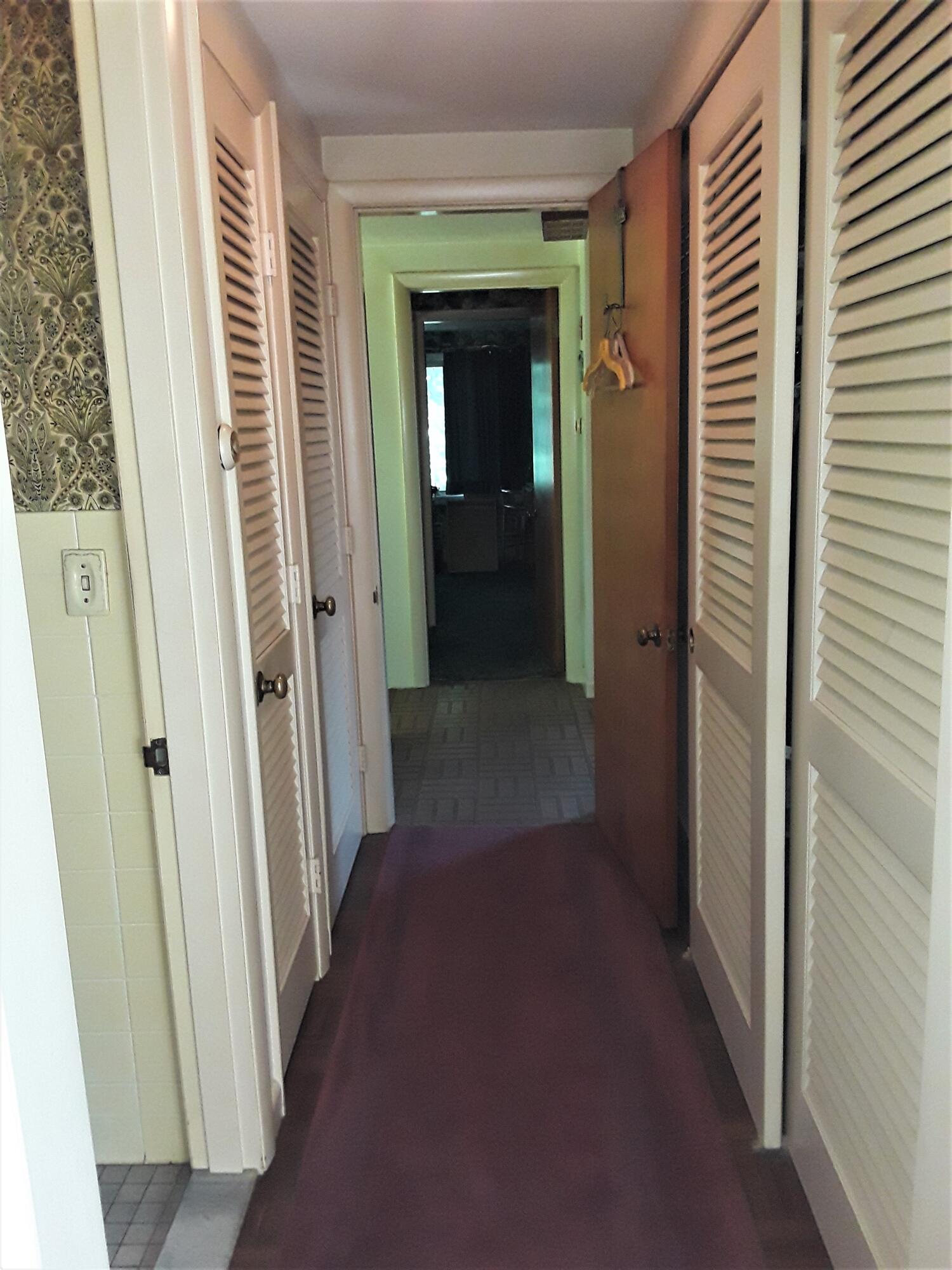 60 Cedar Land Road Orleans, MA 02653 - Photo 24 of 30 a view of a hallway with wooden floor and a bathroom