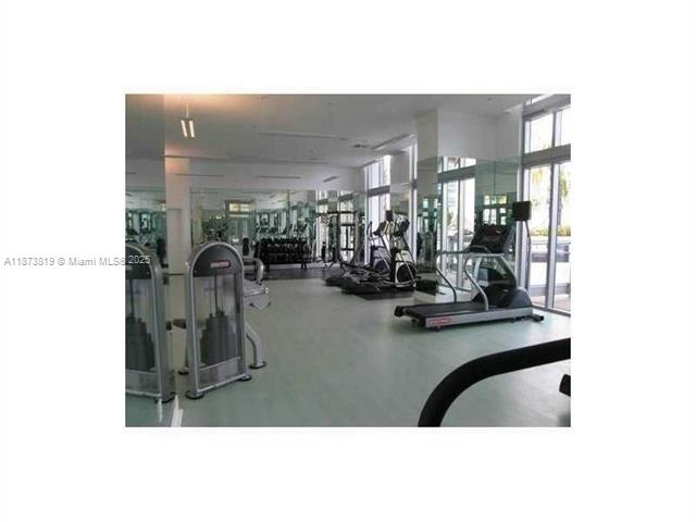 90 Southwest 3rd Street, Unit 1809 Miami, FL 33130 - Photo 17 of 35 a view of a room with gym equipment